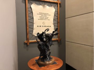 air canada maple leaf lounge calgary bullrider statue